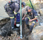 The shaft camera being lowered down an abandoned mine to check the water level in the shaft.